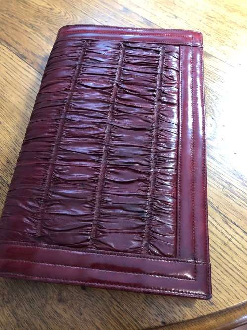 Genuine eelskin rusched clutch handbag